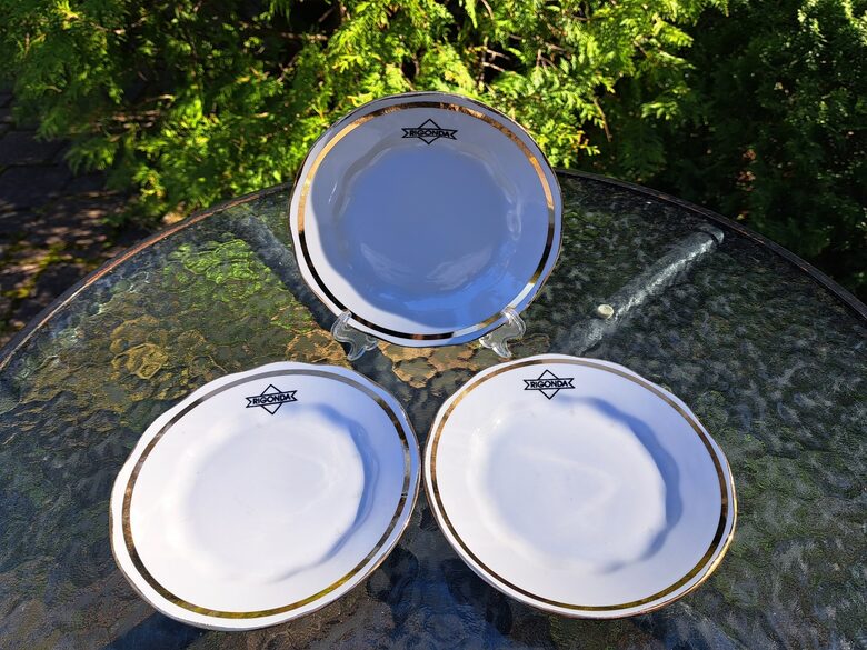 Kūku šķīvīši d=15,5cm ar uzrakstu "RIGONDA" logotipā un zelta apilkumu, RPR (LOGO 62)